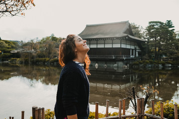 .Young occidental woman discovering the nipon country. Tourism in the temples and gardens of Kyoto...