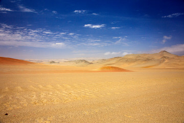 Naklejka na ściany i meble The desert in Paracas in Peru. Yta sea and sand
