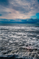 blue sea and cloudy sky waves