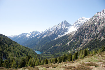 landscape in the alps with blue lake