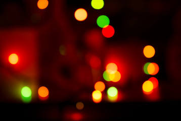 Christmas abstract background with glowing bokeh. For this photo applied blurring effect.