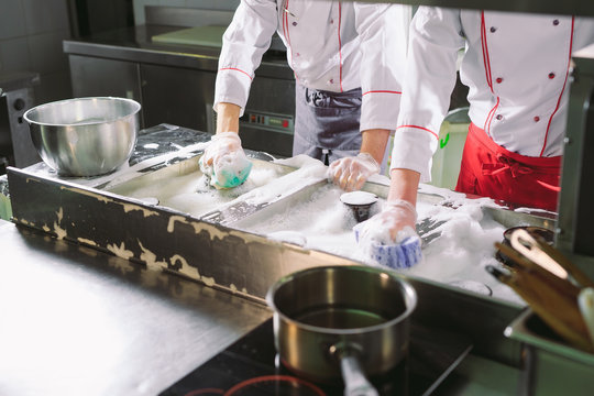 Sanitary day in the restaurant. Repeats wash your workplace. Cooks wash oven, stove and extractor in the Restaurant.