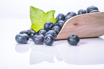  Blueberry blueberries are a healthy food with a green leaf in black or white background