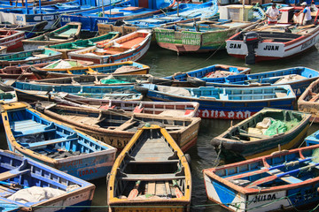 Fototapeta na wymiar Boats in the harbour by fishermen in Peru