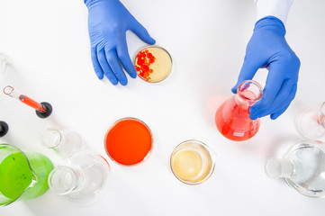 view of a human hands in the laboratory while performing experiments