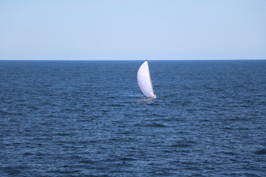 White Sailboat between Germany and Sweden in Baltic Sea