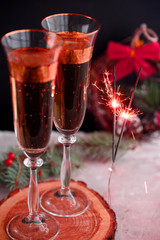 Two glass champagne glasses.Two beautiful glass champagne glasses on New Year's Eve.painted in the fashionable color of 2019