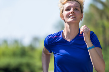 young female runner training for marathon