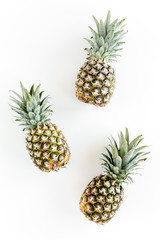 Pineapples isolated on white background. Food concept. Flat lay, top view
