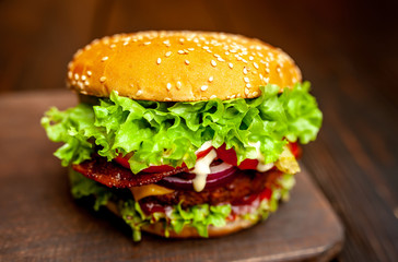 mouth-watering delicious homemade burger used to chop beef on the wooden table