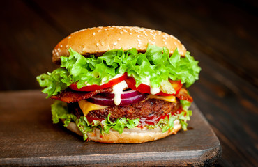 mouth-watering delicious homemade burger used to chop beef on the wooden table