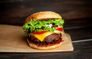 mouth-watering delicious homemade burger used to chop beef on the wooden table