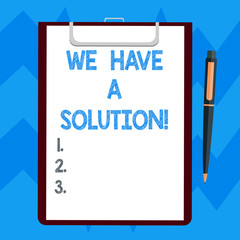 Text sign showing We Have A Solution. Conceptual photo Offering to bring you the assistance help you need Blank Sheet of Bond Paper on Clipboard with Click Ballpoint Pen Text Space