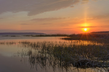 Sunset over the river in the spring