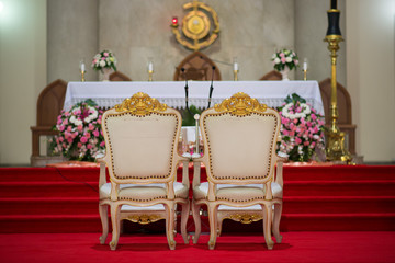 Fototapeta na wymiar Chair of the bride and groom Beautiful church For wedding ceremony - Images