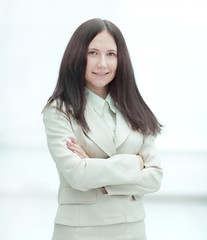 portrait of young business woman on office window background