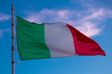 Image of national tricolour flag of Italy on flagpole