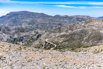 Psilorities mountain range panoramic skyline view at 2000m altutude. Mountaineering adventure trekking paradise, hiking paths, biking trails, challenging peaks. Heraklion, Crete Greece.