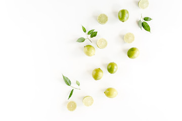 Pattern made of lime and leaves ficus. Food concept.  flat lay, top view