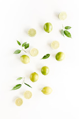 Pattern made of lime and leaves ficus. Food concept.  flat lay, top view