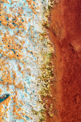 Texture of dry and cracked earth on the banks of the Rio tinto