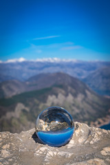 Fototapeta na wymiar Kotor Bay reflected on a glass ball