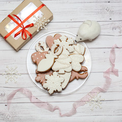 Christmas gingerbread cookies on light wooden background