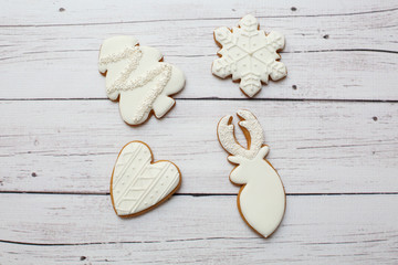 Christmas gingerbread cookies on light wooden background