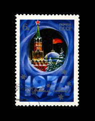Moscow Kremlin tower with red star, red USSR flag, fir-tree, snow for Christmas, circa 1973. New...
