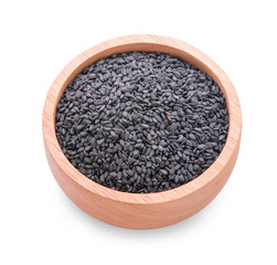 Black sesame in a wooden cup on a white background