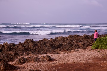 Woman looking at the ocean