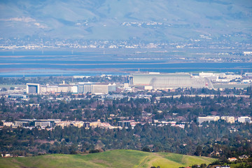 Aerial view of the NASA Ames Research Center and Moffett field on the shoreline of south San Francisco bay area, Mountain View, California