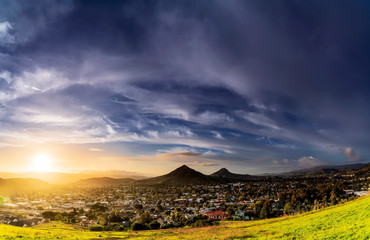 Sunset in the Mountains with City Below
