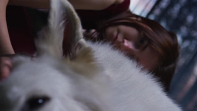 White dog and a young woman