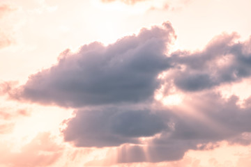 Dramatic, orange, yellow, purple sunset, sun behind clouds in sky with god rays in Bahia Honda key...