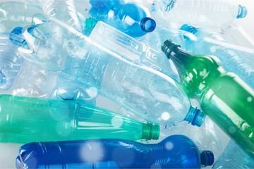 Plastic bottles of water isolated on background
