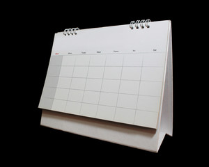 Blank desktop calendar isolated on black background.