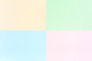 Background pastel colors: pink, yellow, blue, green. Geometric pattern papers. Minimal concept. Flat lay, Top view. 