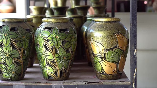 Handmade traditional craft known as 'labu sayong' normally used as gift or souvenir found in Perak,Malaysia. Clay pottery arts. Artistic clay container carving. GRADED.Panning Shot