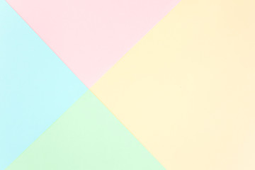 Background pastel colors: pink, yellow, blue, green. Geometric pattern papers. Minimal concept. Flat lay, Top view. 