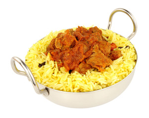 Lamb rogan josh meal with fragrant pilau rice isolated on a white background