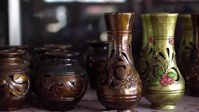 Handmade traditional craft known as 'labu sayong' normally used as gift or souvenir found in Perak,Malaysia. Clay pottery arts. Artistic clay container carving. GRADED.Panning Shot