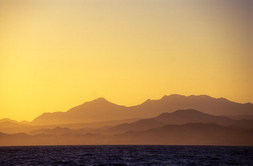 sunrise set with  baja mexico mountains