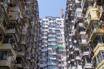 Famous building name Yick Fat Yick residentrial building at Cheong Fok Cheong in Quarry Bay, Hong Kong with urban housing apartment background.