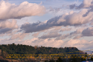 landscape with blue sky and clouds and crane