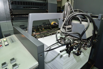 Close up of an offset printing machine during production