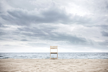 Fototapeta na wymiar A chair on the beach.