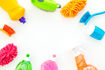 Housekeeping set. Detergents, soap, cleaners and brush for housecleaning on white background top view mock-up