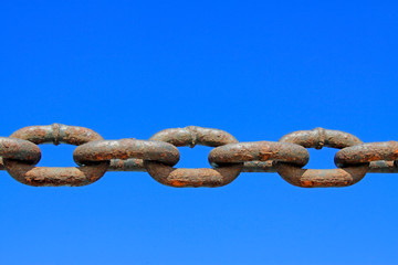oxidation rusty chains under the blue sky