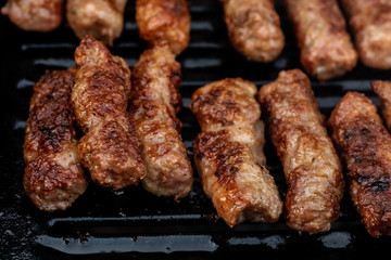 bosnian cuisine "Ćevapčići" - meat sausages on the grill
